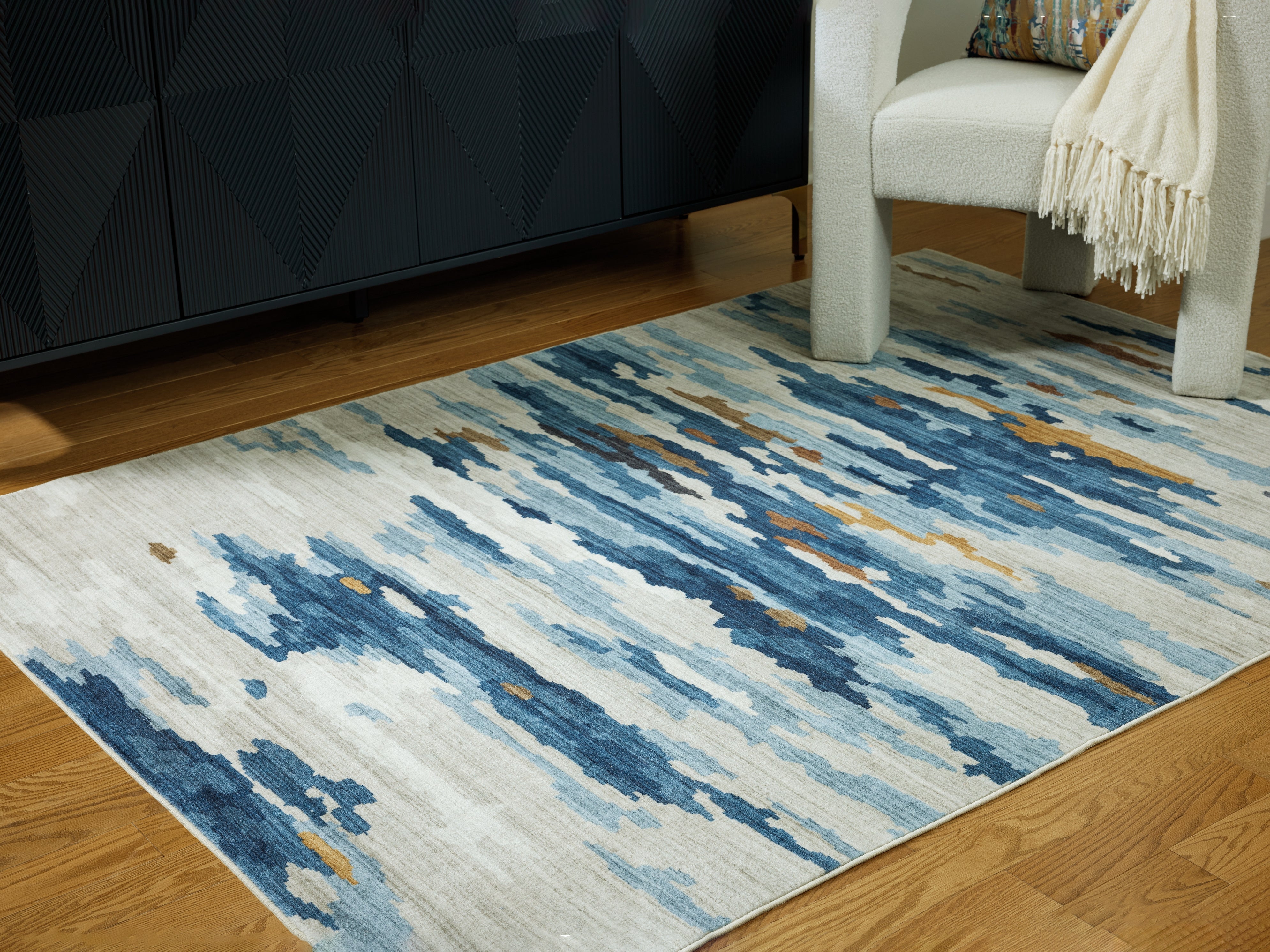Fine Furniture & Decor - Ashley Furniture - Vinlett Rug - 5' x 7' Washable Rug / Cream/Blue/Brown - R407042