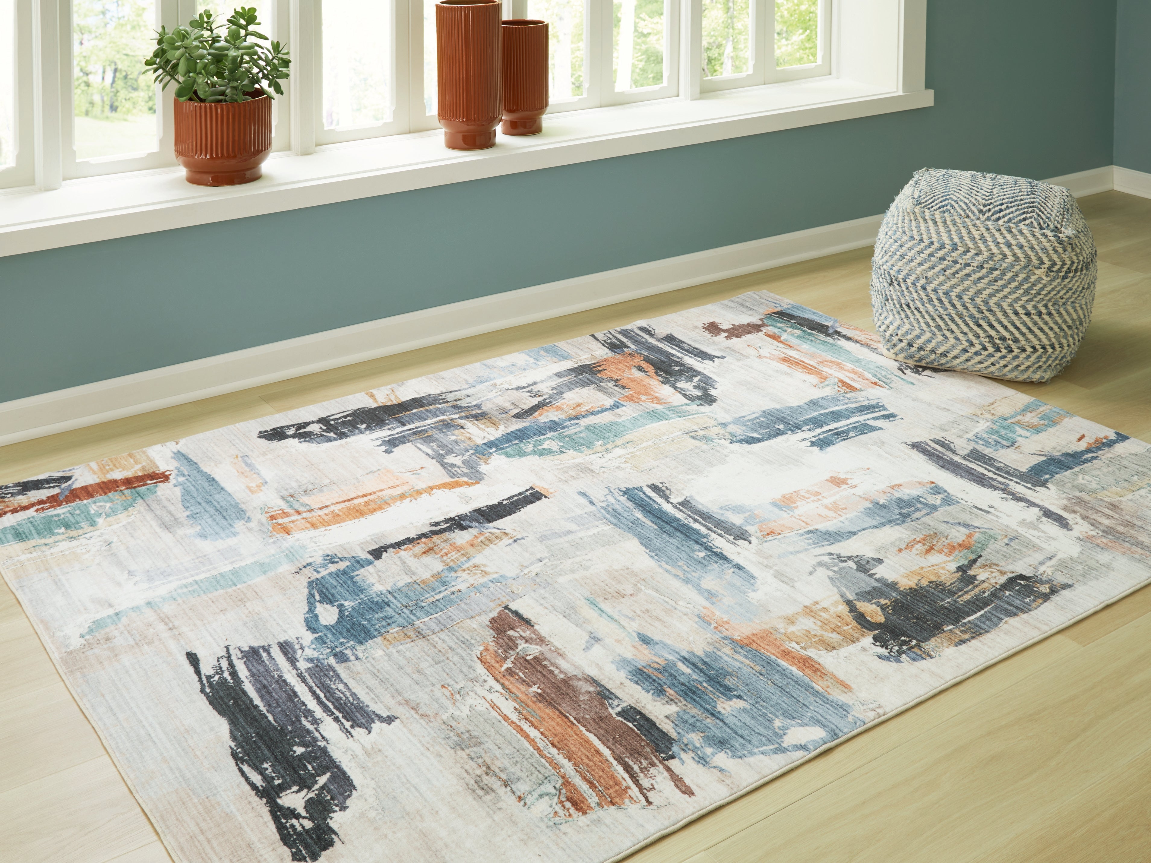 Fine Furniture & Decor - Ashley Furniture - Hessland Rug - 5' x 7' Washable Rug / Multi - R407052