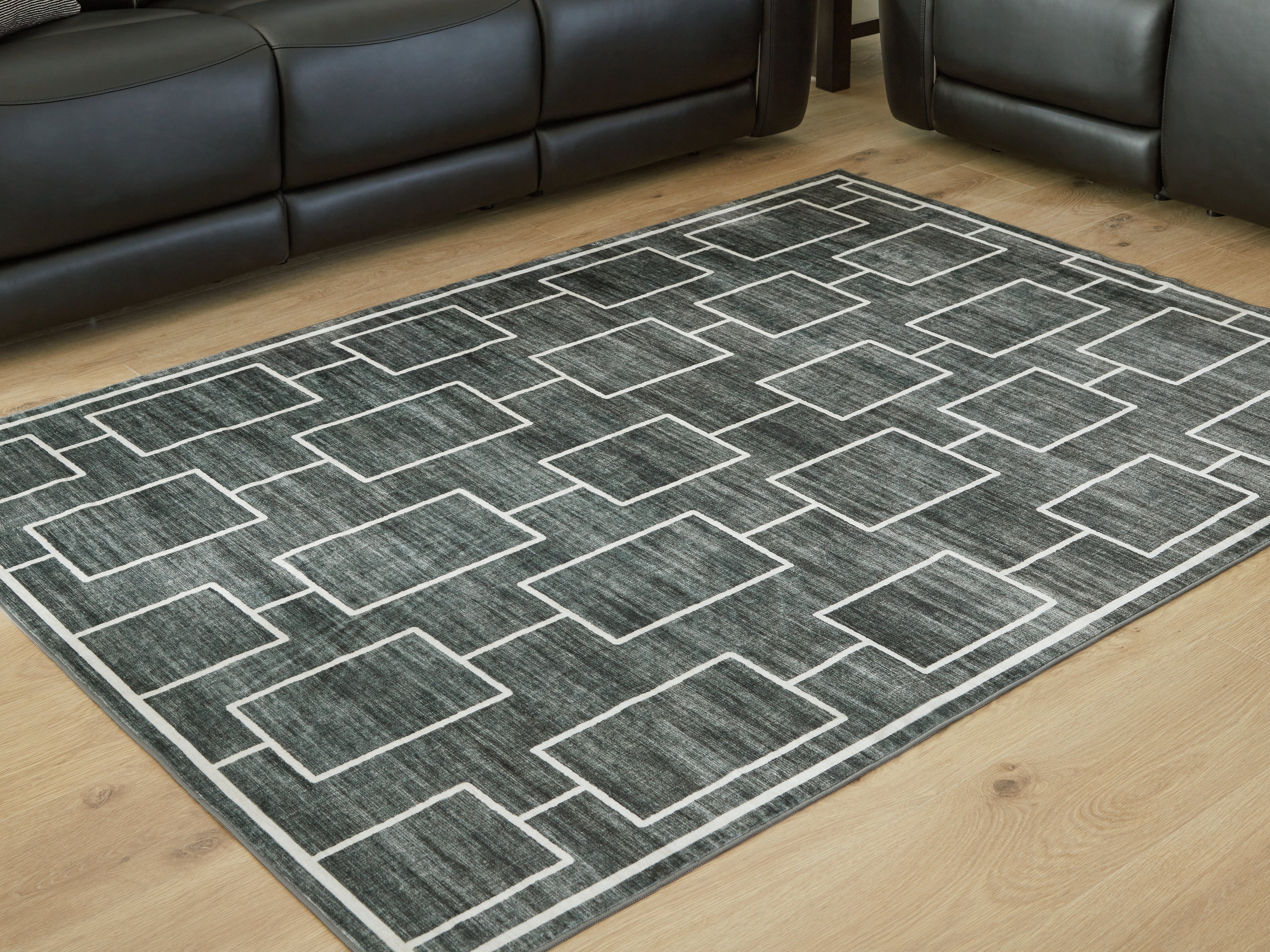 Fine Furniture & Decor - Ashley Furniture - Elderland Rug - Washable 7'6" x 9'6" Area Rug / Black/Gray - R407401