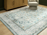 Fine Furniture & Decor - Ashley Furniture - Ladstoney Rug - 5' x 7' Area Rug / Teal/Beige/Ochre - R407502