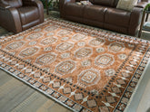 Fine Furniture & Decor - Ashley Furniture - Qaabiz Rug - 7'8" x 10' Area Rug / Sienna/Ivory/Black - R407521