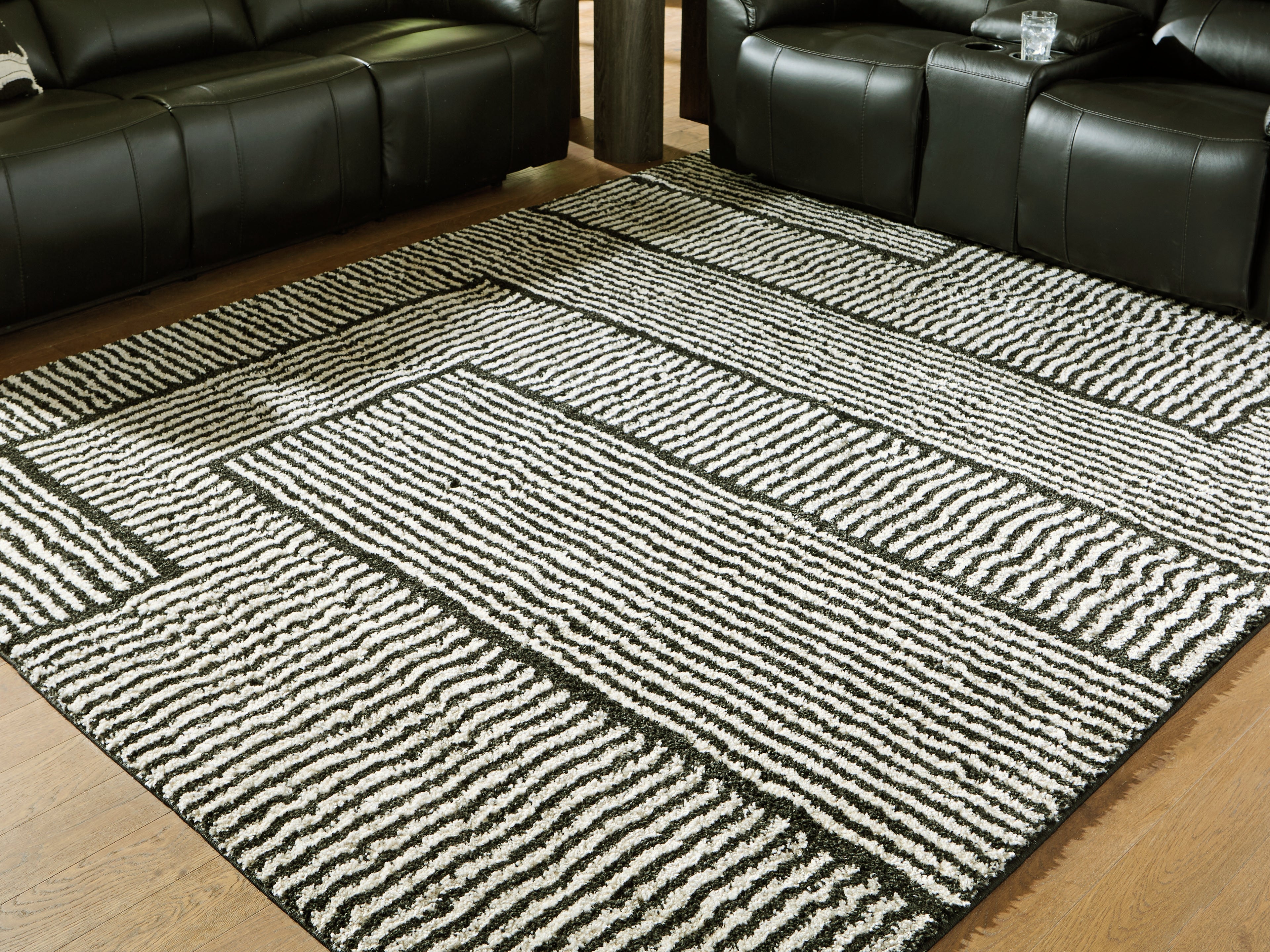 Fine Furniture & Decor - Ashley Furniture - Kurtmen Rug - 5' x 7' Area Rug / Black/Ivory - R407592