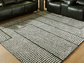Fine Furniture & Decor - Ashley Furniture - Kurtmen Rug - 5' x 7' Area Rug / Black/Ivory - R407592