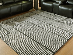 Fine Furniture & Decor - Ashley Furniture - Kurtmen Rug - 5' x 7' Area Rug / Black/Ivory - R407592