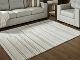 Fine Furniture & Decor - Ashley Furniture - Gadence Rug - 7'8" x 10' Area Rug / Ivory/Tan - R407641