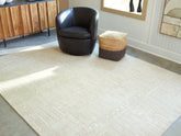 Fine Furniture & Decor - Ashley Furniture - Wolbert Rug - 5' x 7' Area Rug / Tan/Ivory - R407662
