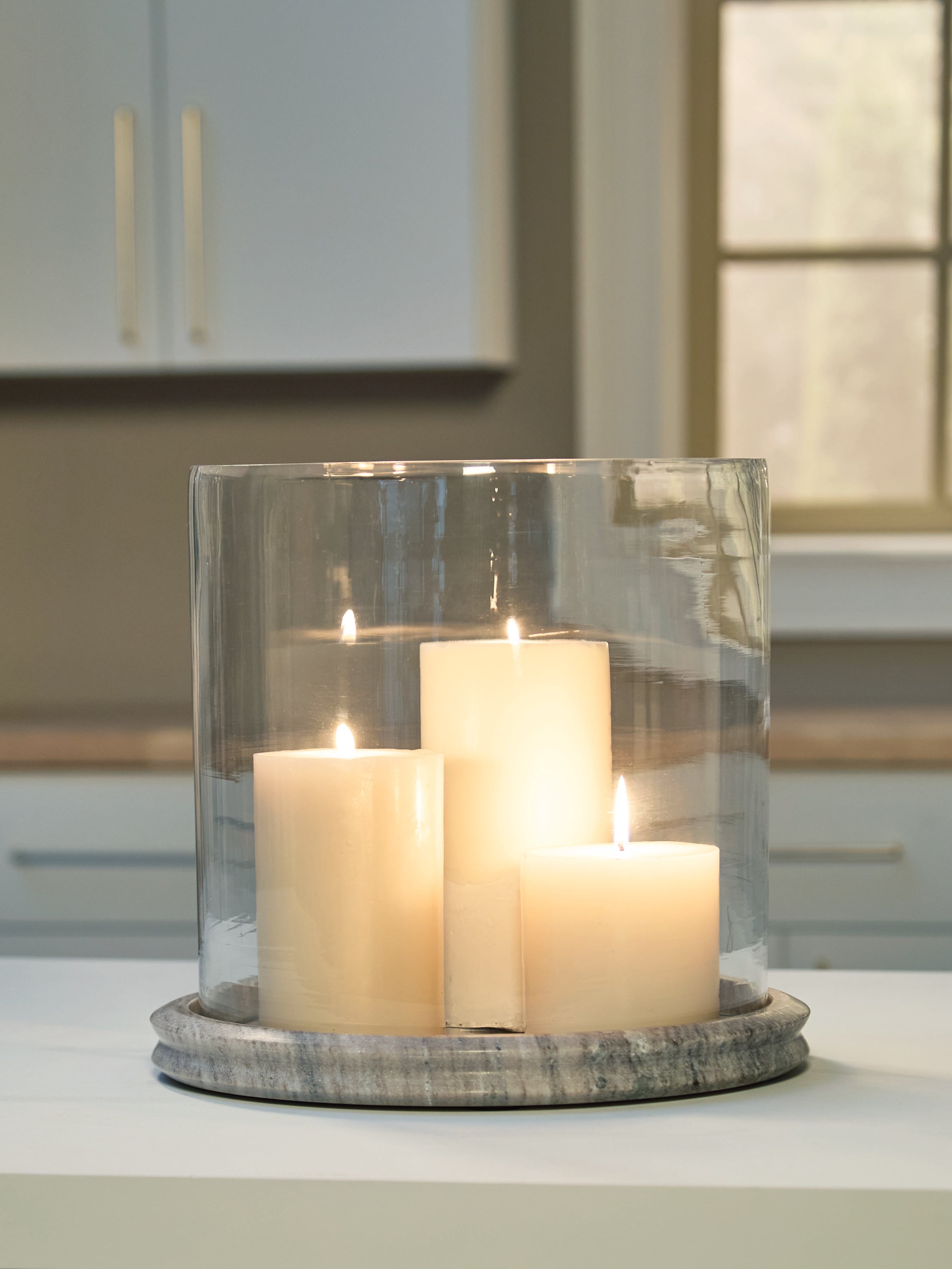 Fine Furniture & Decor - Ashley Furniture - Saskia Candle Holder - Candle Holder / Clear/Beige - A2000847