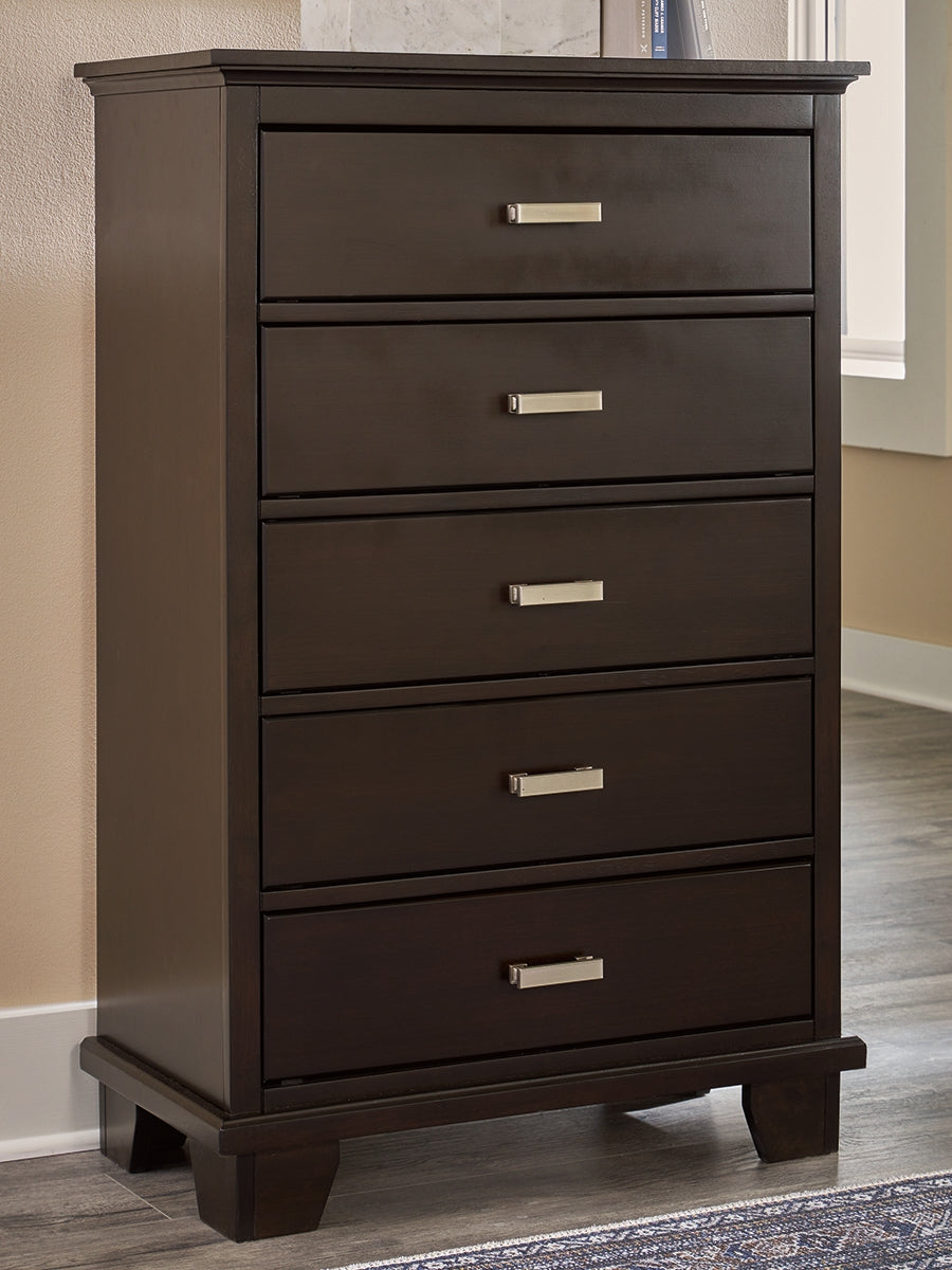 Fine Furniture & Decor - Ashley Furniture - Covetown Bedroom - Five Drawer Chest / Dark Brown - B441-46