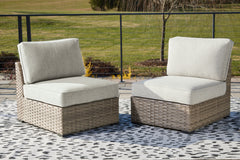 Fine Furniture & Decor - Ashley Furniture - Calworth Outdoor - Armless Chair w/Cushion (Set of 2) / Beige - P458-846