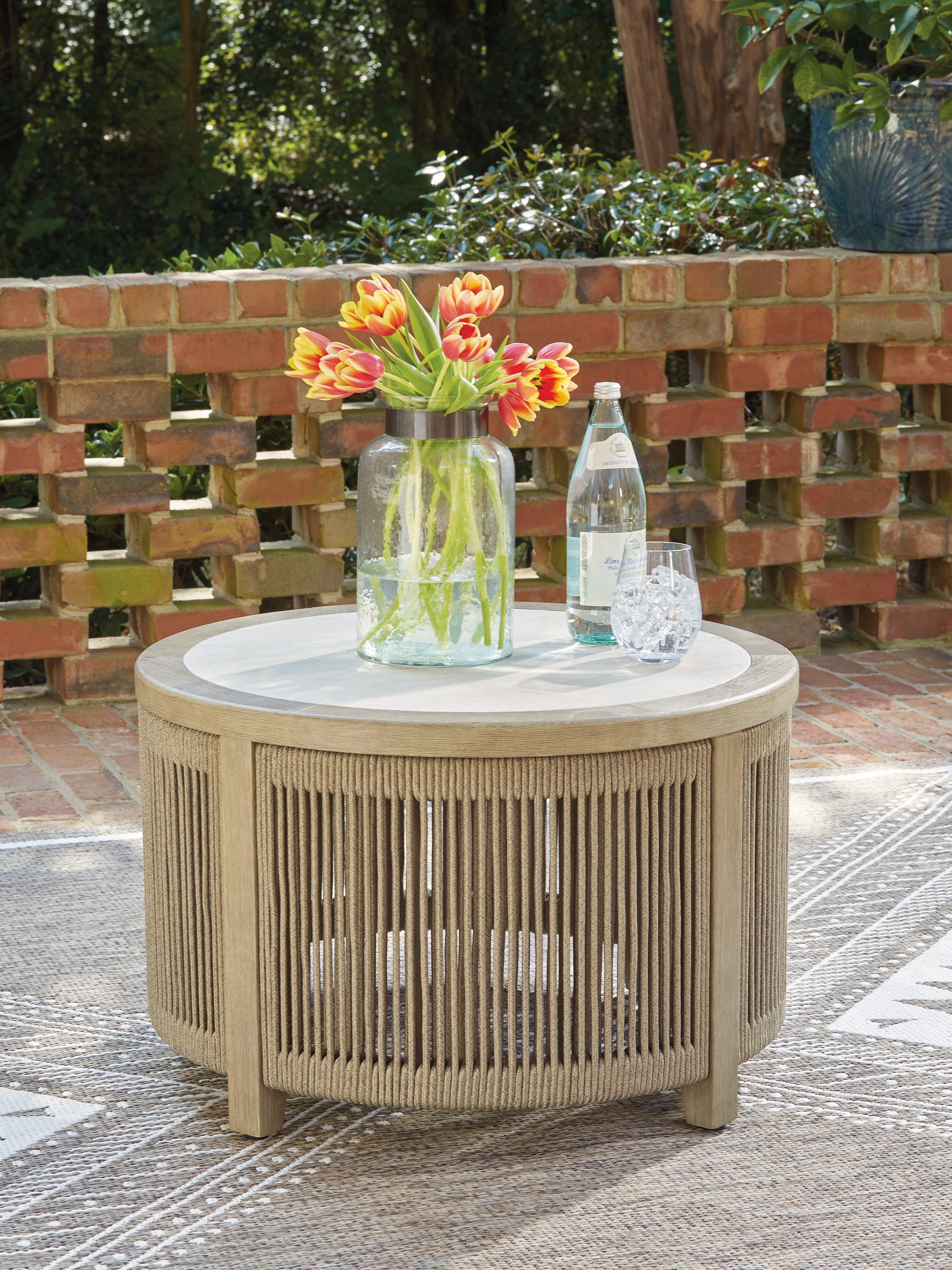 Fine Furniture & Decor - Ashley Furniture - Spooners Cove Outdoor - Round Cocktail Table / Beige - PCP469-708
