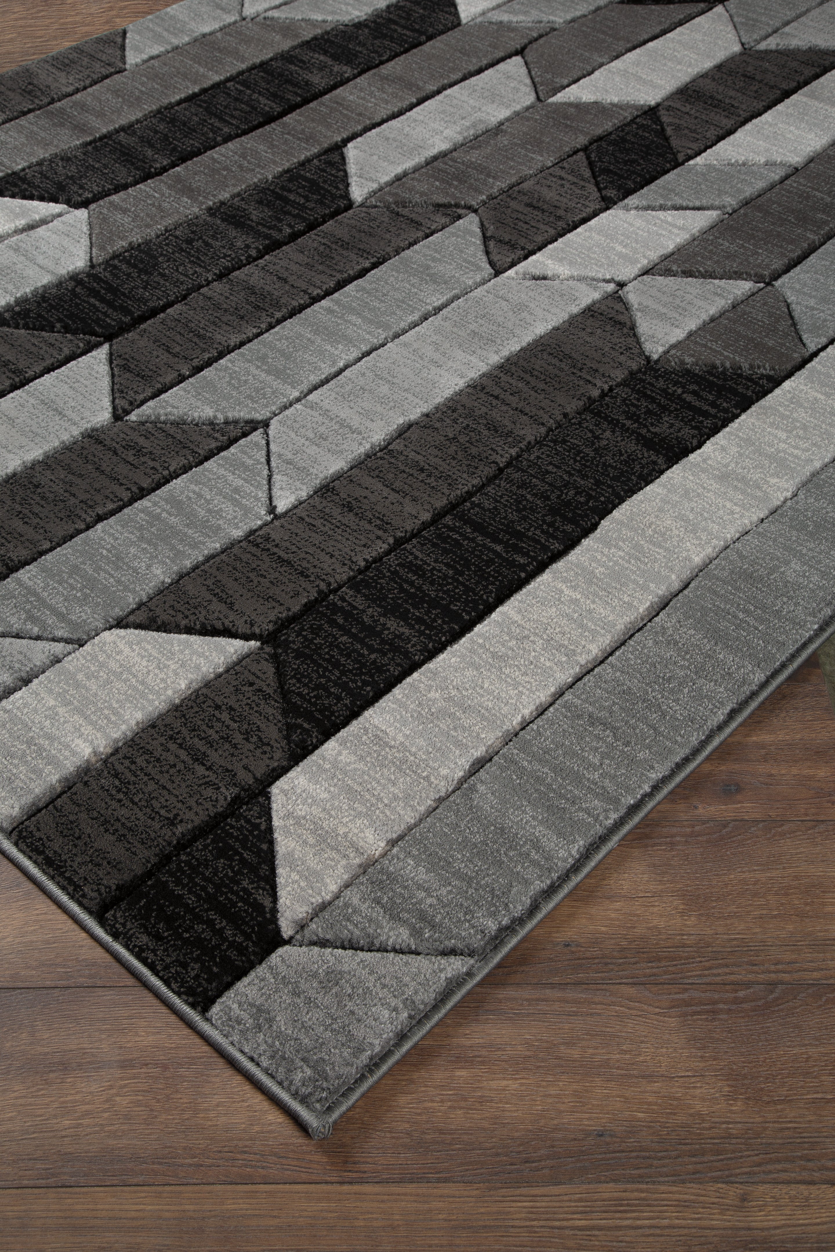 Fine Furniture & Decor - Ashley Furniture - Chayse Rug - 6'6" x 9'6" Rug / Black/Gray - R403461
