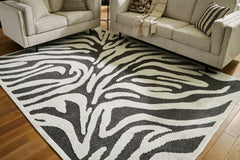 Fine Furniture & Decor - Ashley Furniture - Thomwith Rug - 8' x 10'2" Washable Rug / Black/Ivory - R406291