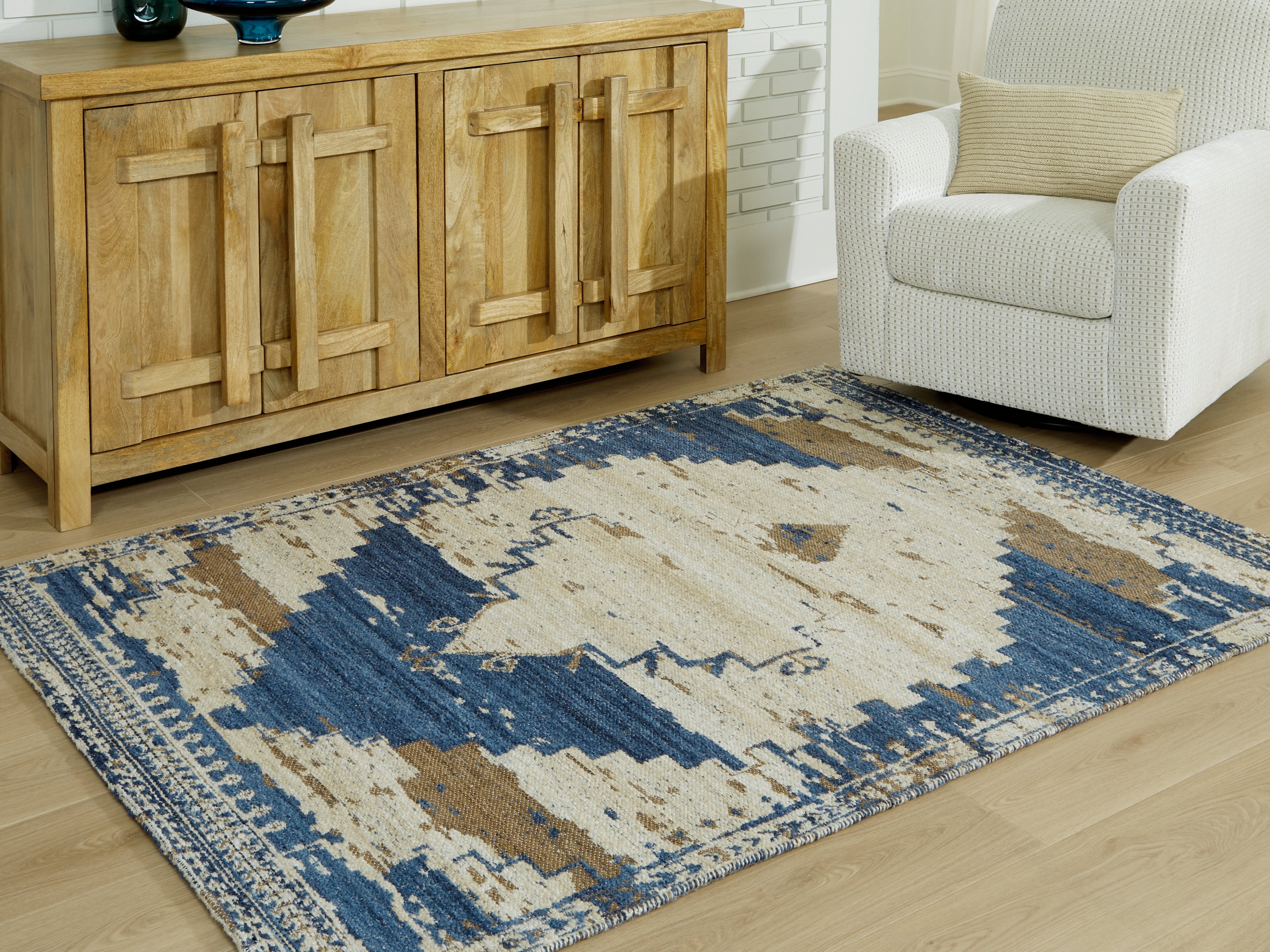 Fine Furniture & Decor - Ashley Furniture - Varnler Rug - 5' x 7' Rug / Blue/Brown/Tan - R407132