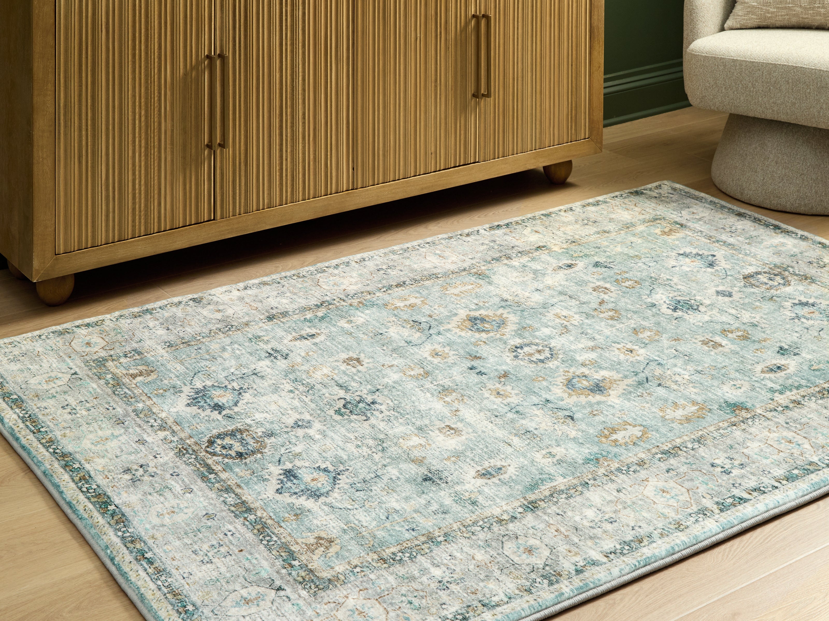 Fine Furniture & Decor - Ashley Furniture - Ladstoney Rug - 5' x 7' Area Rug / Teal/Beige/Ochre - R407502