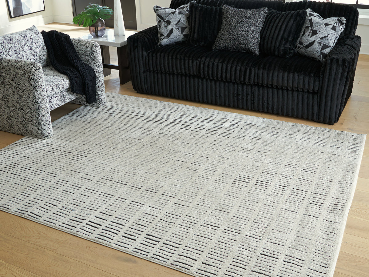 Fine Furniture & Decor - Ashley Furniture - Turinwith Rug - 5'3" x 7' Area Rug / Ivory/Black - R407552