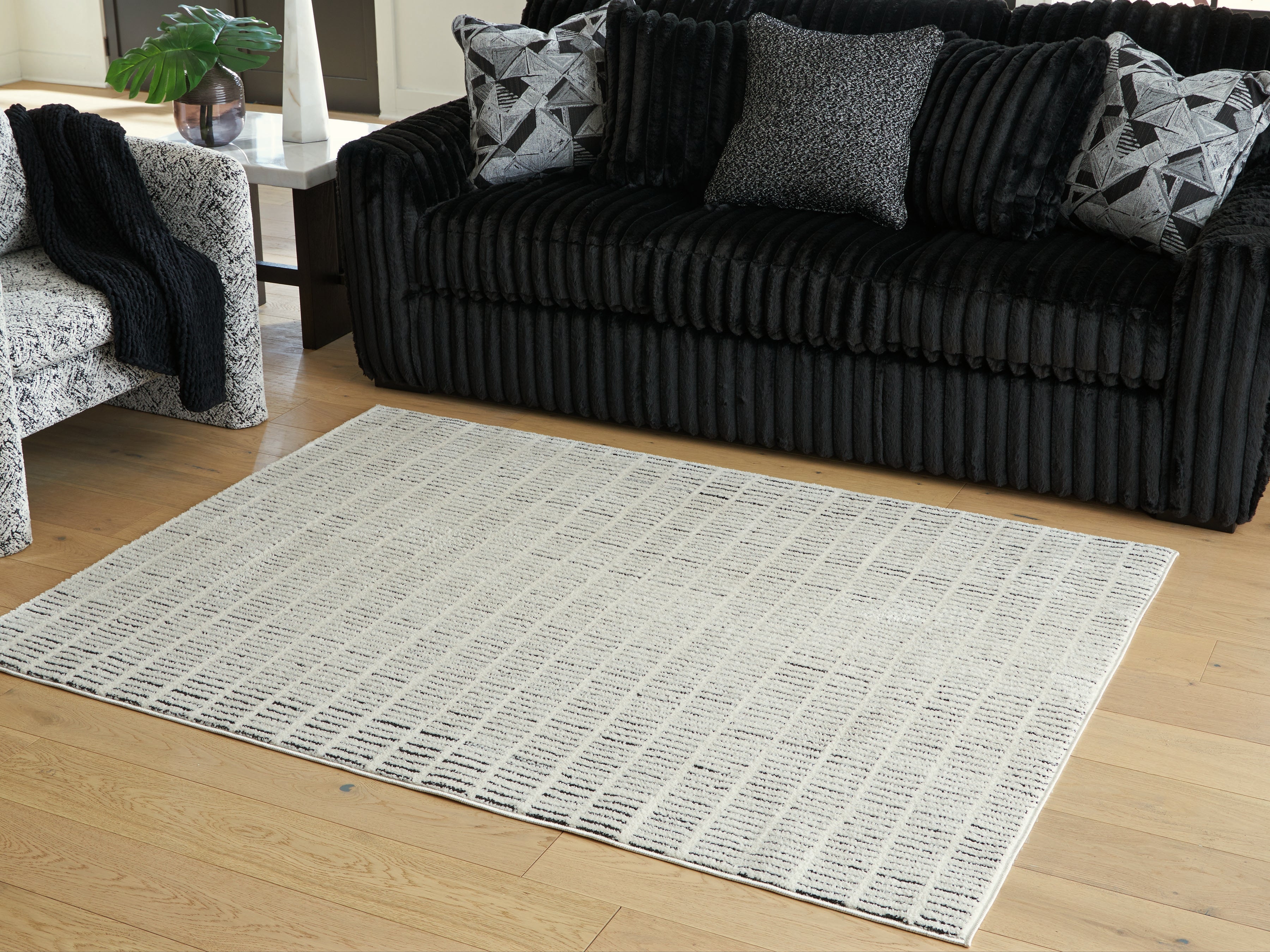 Fine Furniture & Decor - Ashley Furniture - Turinwith Rug - 5'3" x 7' Area Rug / Ivory/Black - R407552