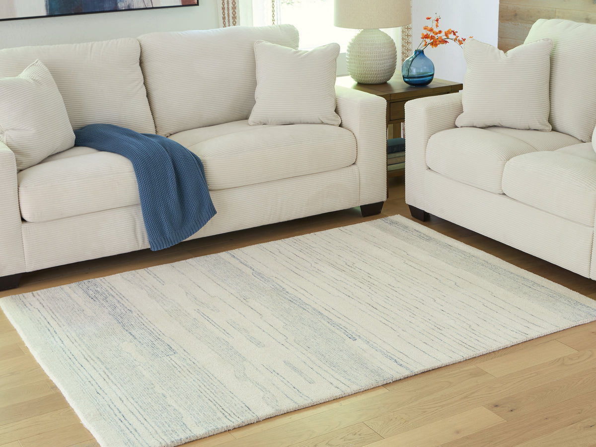 Fine Furniture & Decor - Ashley Furniture - Genemost Rug - 5' x 7' Area Rug / Ivory/Blue - R407842